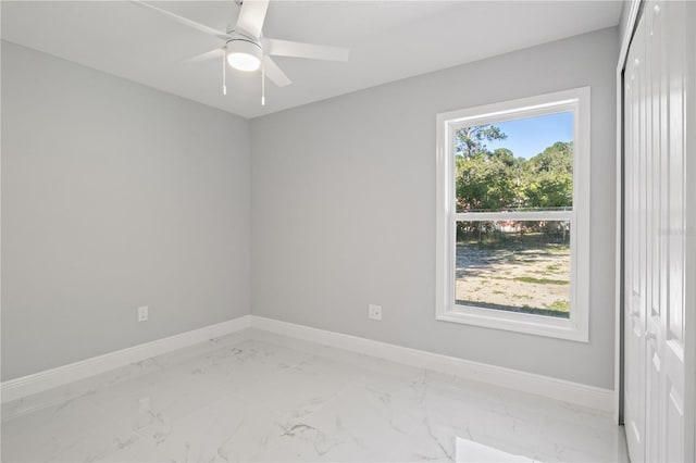 unfurnished room with ceiling fan