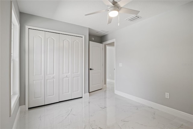 unfurnished bedroom with a closet and ceiling fan