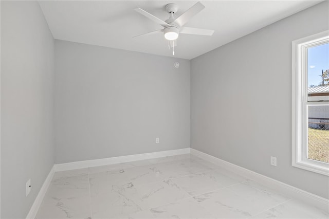 unfurnished room with ceiling fan