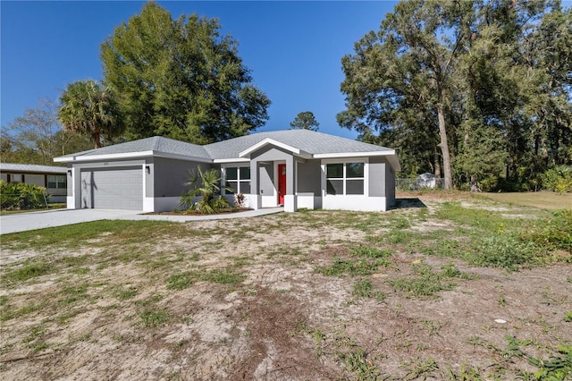 single story home with a garage and a front lawn