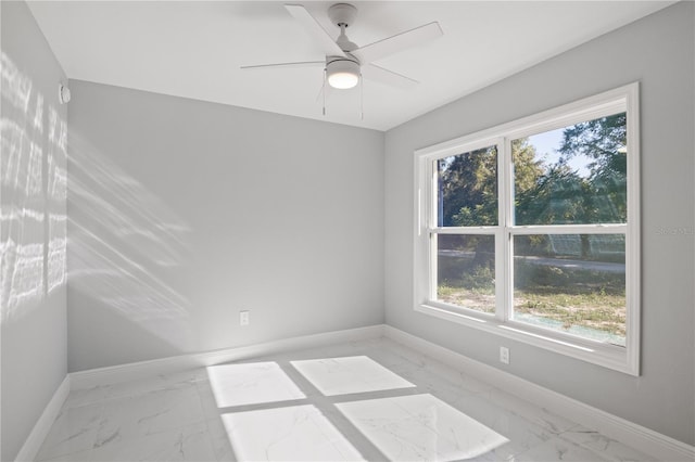 spare room featuring ceiling fan