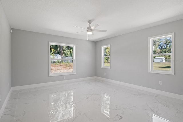 spare room with ceiling fan