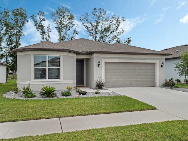 view of front facade featuring a garage and a front lawn