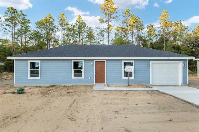 single story home featuring a garage