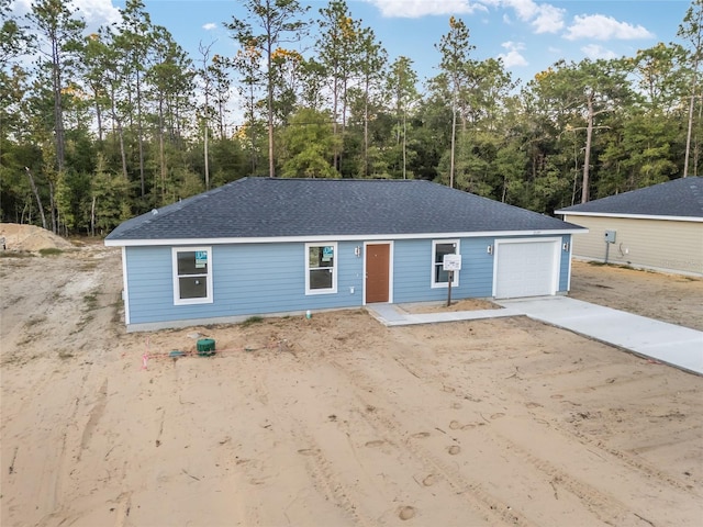 single story home with a garage