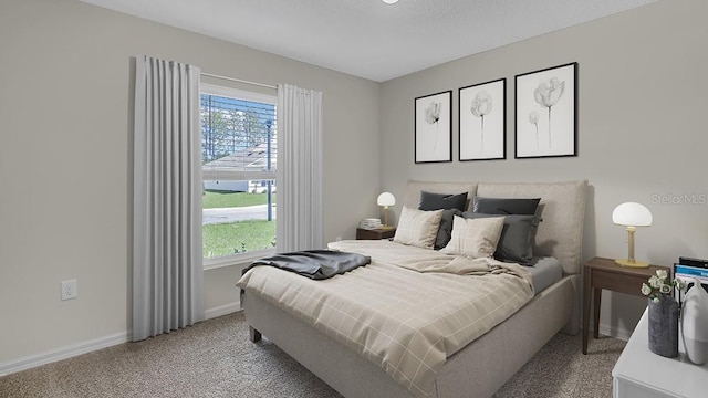 carpeted bedroom featuring a textured ceiling