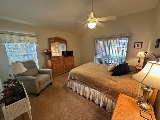 carpeted bedroom with access to exterior, multiple windows, and ceiling fan