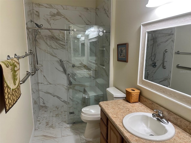 bathroom with walk in shower, vanity, and toilet