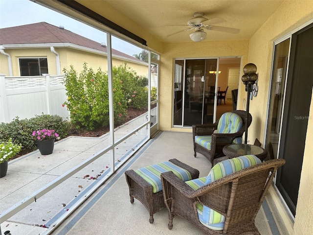 view of patio / terrace with ceiling fan and a balcony