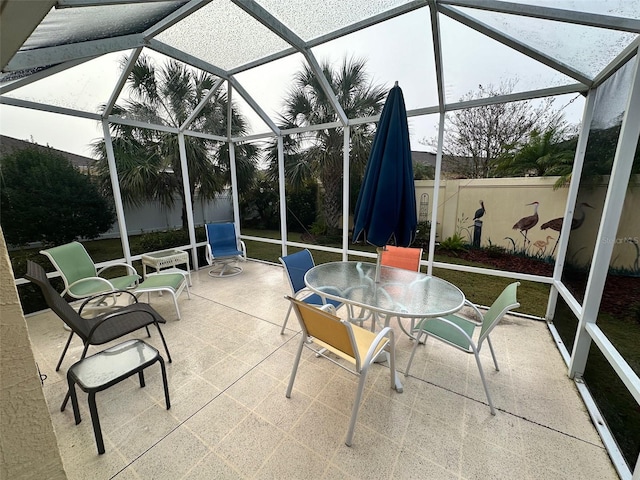 sunroom / solarium featuring lofted ceiling