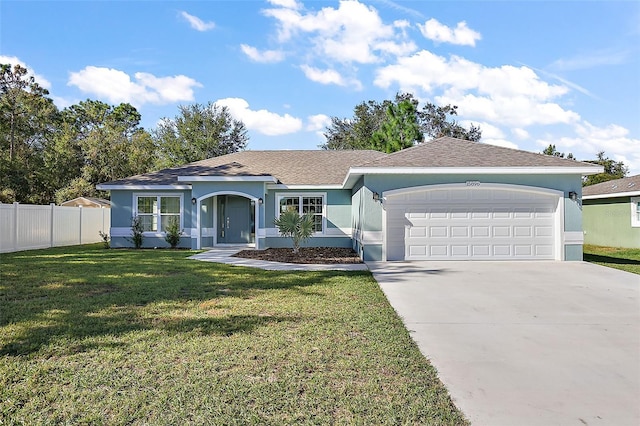 single story home with a front yard and a garage