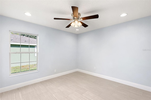 unfurnished room with ceiling fan and a healthy amount of sunlight