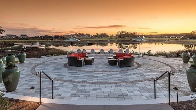 patio terrace at dusk with a water view