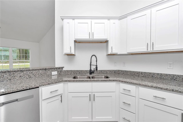 kitchen featuring white cabinets, light stone countertops, dishwasher, and sink