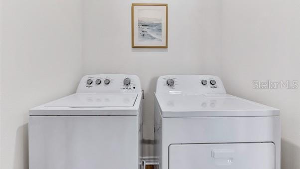 laundry room with washing machine and dryer