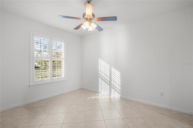 spare room featuring ceiling fan and light tile patterned floors