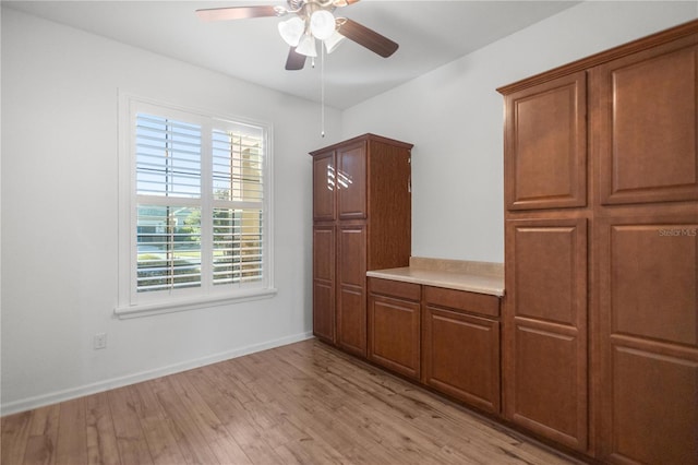 interior space with ceiling fan and light hardwood / wood-style flooring