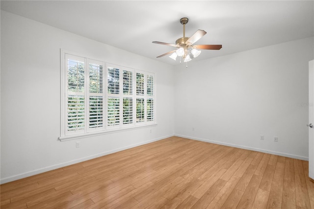 unfurnished room with ceiling fan and light hardwood / wood-style flooring