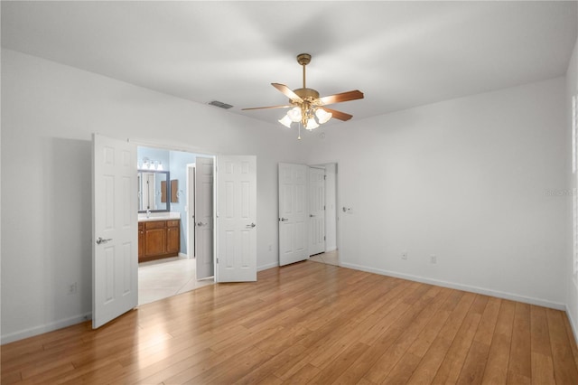 unfurnished bedroom with light wood-type flooring and ceiling fan