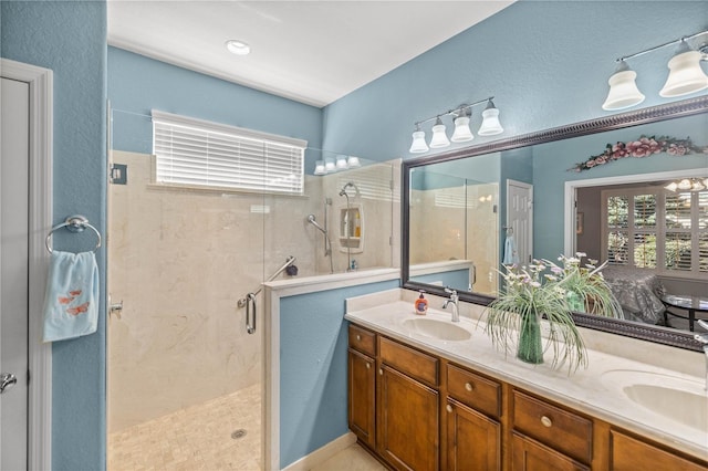 bathroom featuring vanity and an enclosed shower