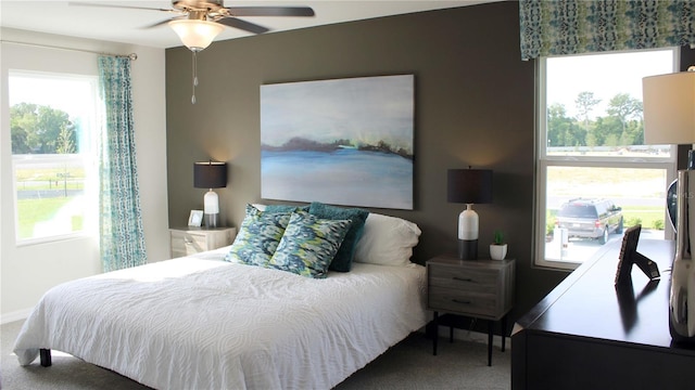 bedroom featuring ceiling fan and carpet floors