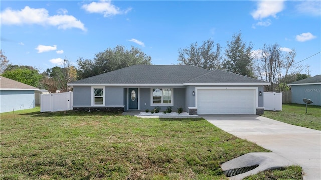 ranch-style home with a garage and a front lawn