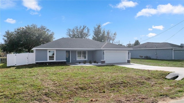 ranch-style house featuring a front yard and a garage