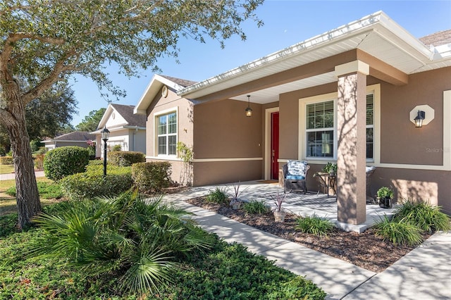 9350 SW 91st Court Rd, Ocala, FL 34481 - ranch-style house with stucco siding and a porch