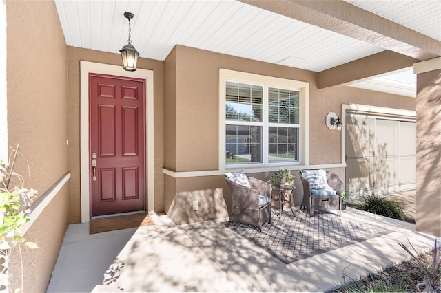 9350 SW 91st Court Rd, Ocala, FL 34481 - view of exterior entry with a porch and stucco siding