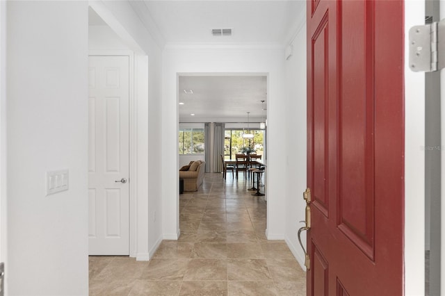 entryway with crown molding