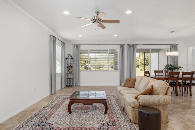 9350 SW 91st Court Rd, Ocala, FL 34481 - living area with ornamental molding, a ceiling fan, baseboards, recessed lighting, and a chandelier