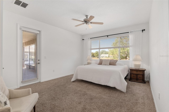 bedroom featuring carpet flooring, ceiling fan, a textured ceiling, and access to outside