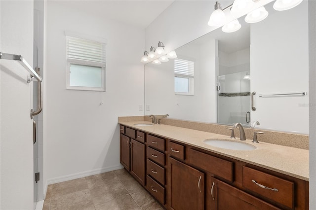 bathroom featuring vanity, tile patterned floors, and walk in shower