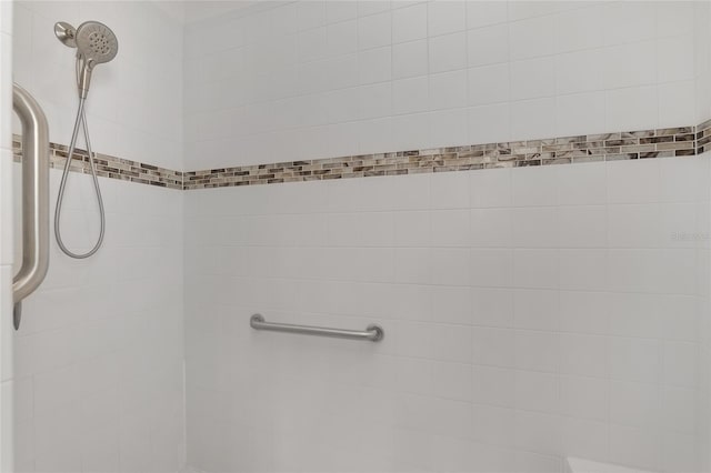 bathroom with a tile shower