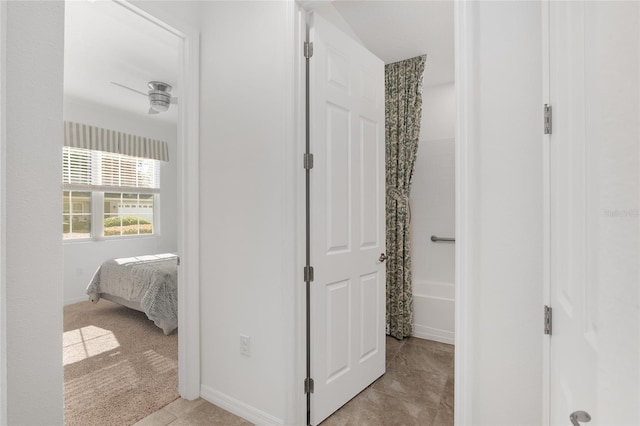 hallway featuring light tile patterned floors