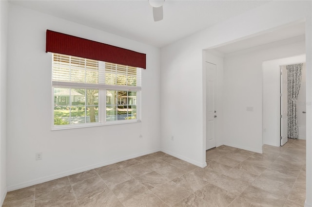 9350 SW 91st Court Rd, Ocala, FL 34481 - empty room featuring healthy amount of natural light, ceiling fan, and baseboards