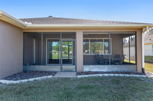 9350 SW 91st Court Rd, Ocala, FL 34481 - entrance to property featuring stucco siding, roof with shingles, and a yard