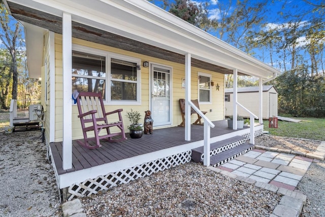 view of exterior entry featuring a porch