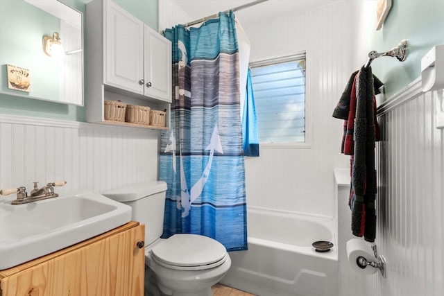 full bathroom featuring toilet, vanity, and shower / tub combo with curtain