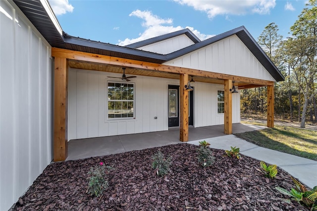 doorway to property featuring ceiling fan