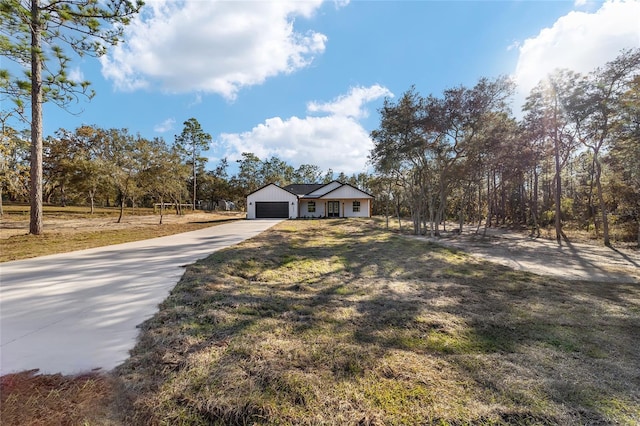 ranch-style home with a front yard and a garage