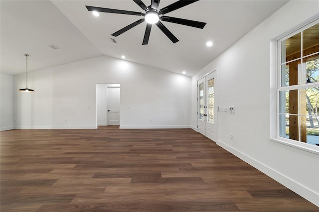 empty room with dark hardwood / wood-style floors, ceiling fan, lofted ceiling, and french doors