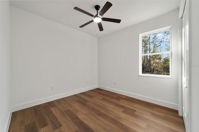 spare room with wood-type flooring and ceiling fan