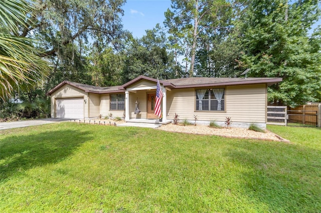 ranch-style house featuring a garage and a front yard