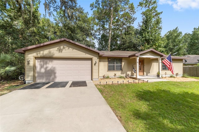 ranch-style house featuring a porch, a garage, and a front lawn