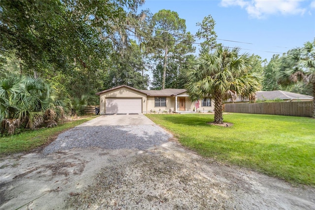 view of front of property featuring a garage and a front lawn