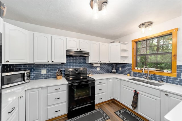 kitchen featuring dark hardwood / wood-style flooring, white cabinetry, black / electric stove, and sink