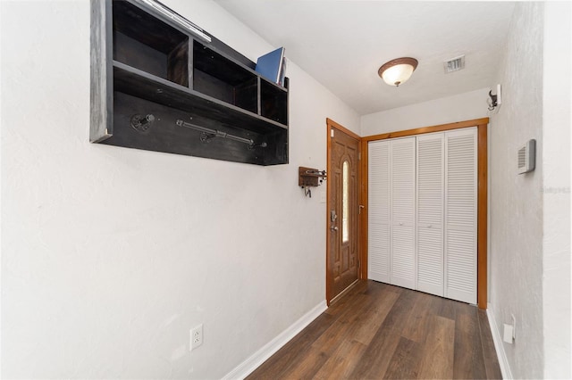 hallway featuring dark wood-type flooring