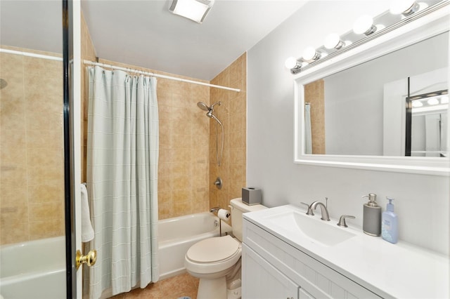 full bathroom with tile patterned floors, vanity, toilet, and shower / bath combo with shower curtain