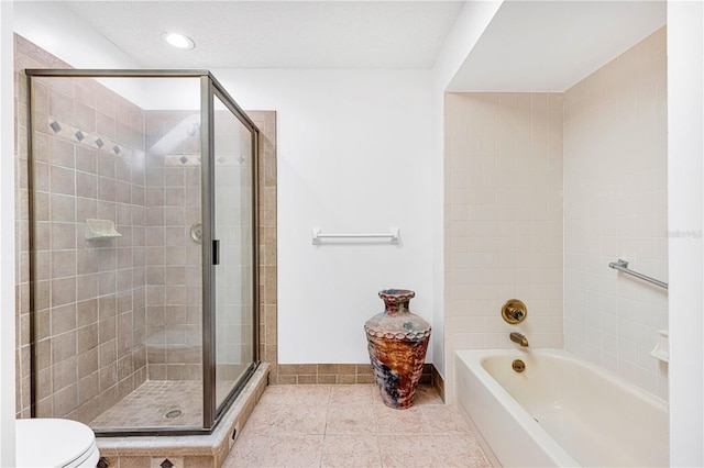 bathroom with tile patterned floors, plus walk in shower, and toilet